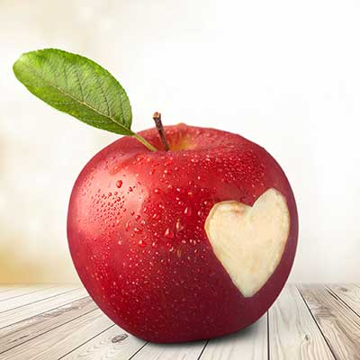 red apple with heart cut out