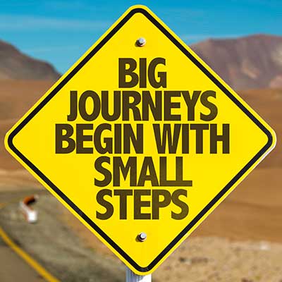 sign - big journeys begin with small steps