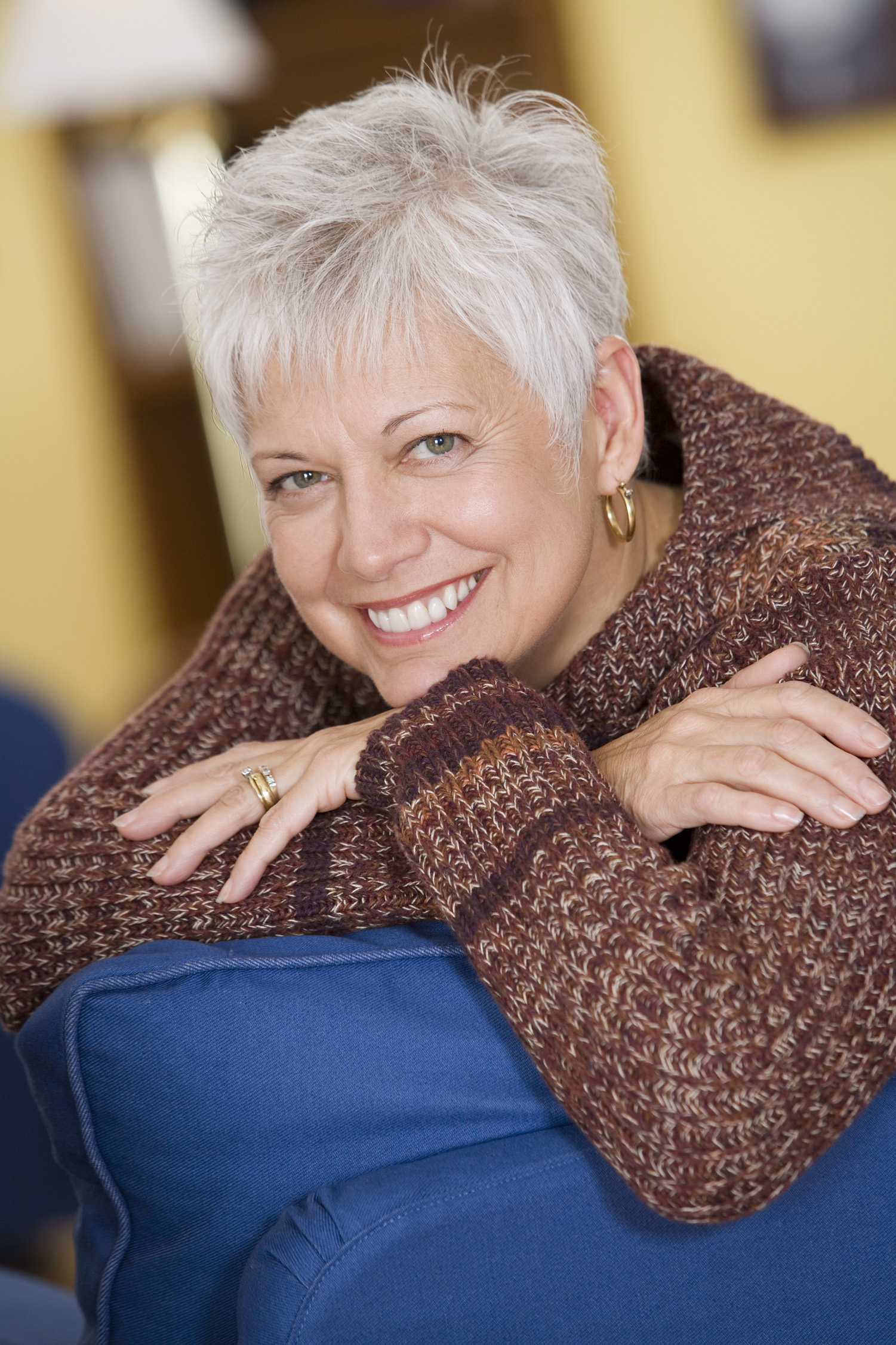 lady with short grey hair smiling